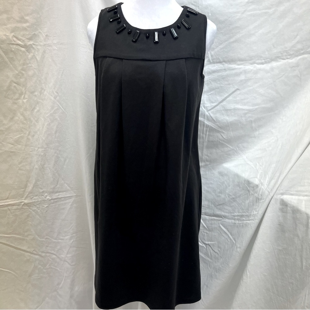 A.P.N.Y. Black sleeveless dress with black gem accents and box pleats.